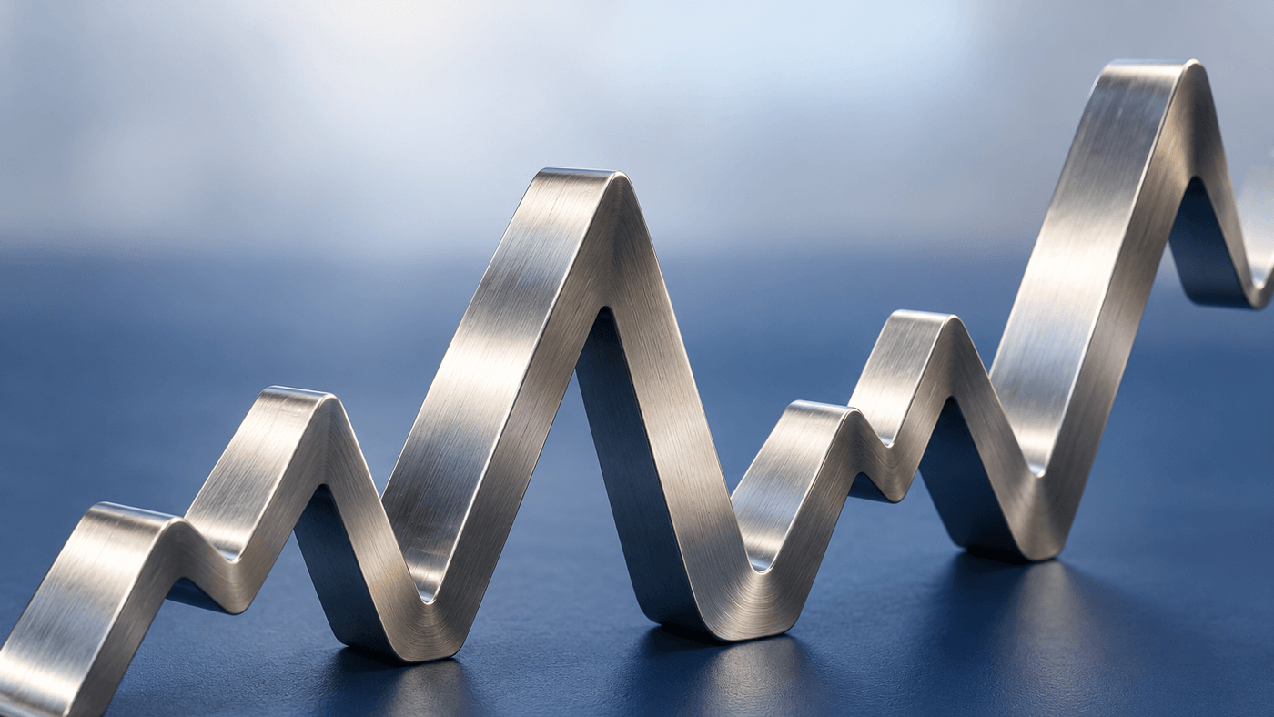 A brushed steel ribbon bent into a jagged line that climbs and dips, standing on a matte blue surface
